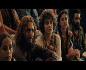 In this scene, Jesus Revolution star actor and pastor Kesley Grammar played by “Chuck Smith” welcomes a group of teenage hippies into his church. Check it out.